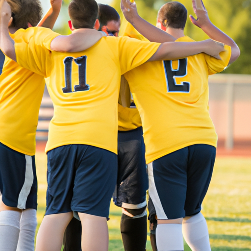 קבוצת כדורגל חוגגת מטרה, המסמלת את המאמץ הקולקטיבי וחשיבות הביצועים הפיזיים של כל שחקן